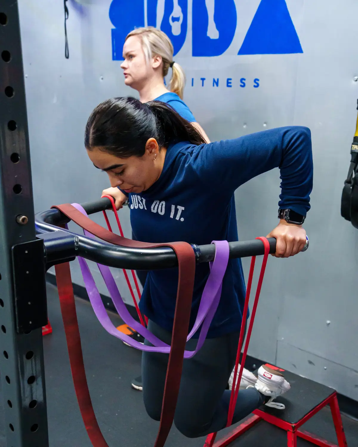 Resistance band strength training in a coach-led bootcamp in Downey, CA
