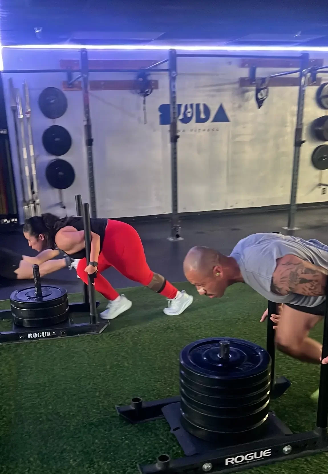 Athletes performing HYROX strength exercises at Suda Fitness Gym in Downey, California